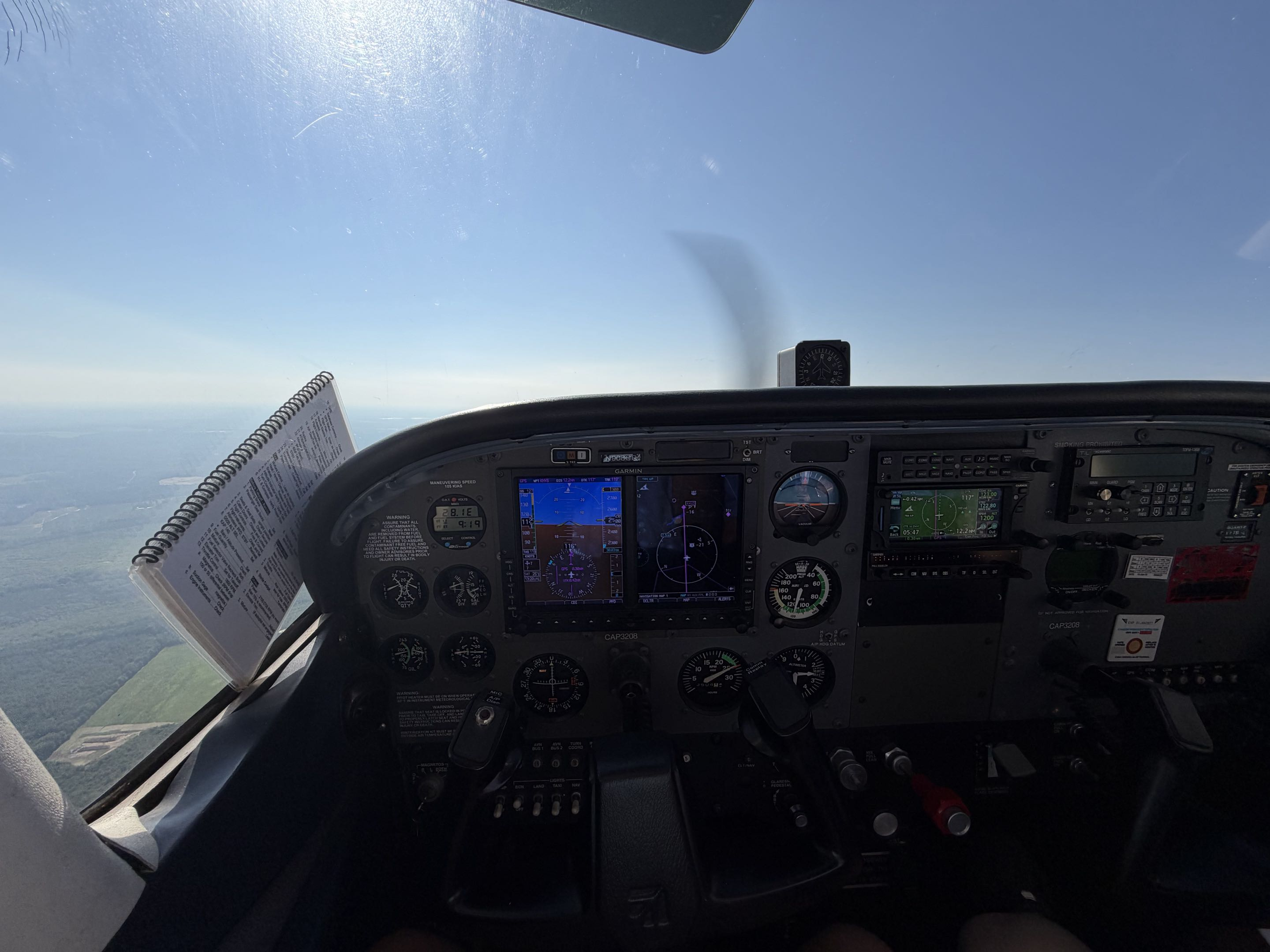 View from an aircraft cockpit above the clouds